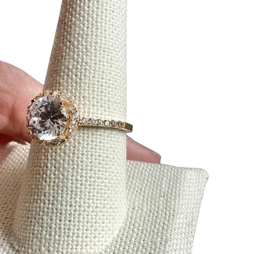Round Clear Stone Set in Gold Tone Band Mini Side Stone Detailing Size 8.75